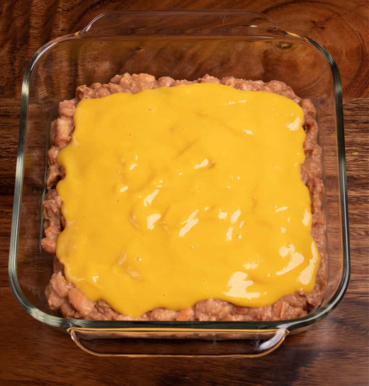 Top down photo of my vegan 7 layer dip topped with my vegan cheese sauce