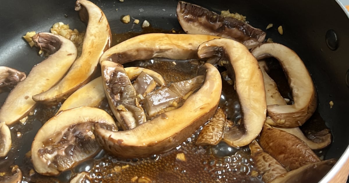 pan of portobello mushrooms cooking