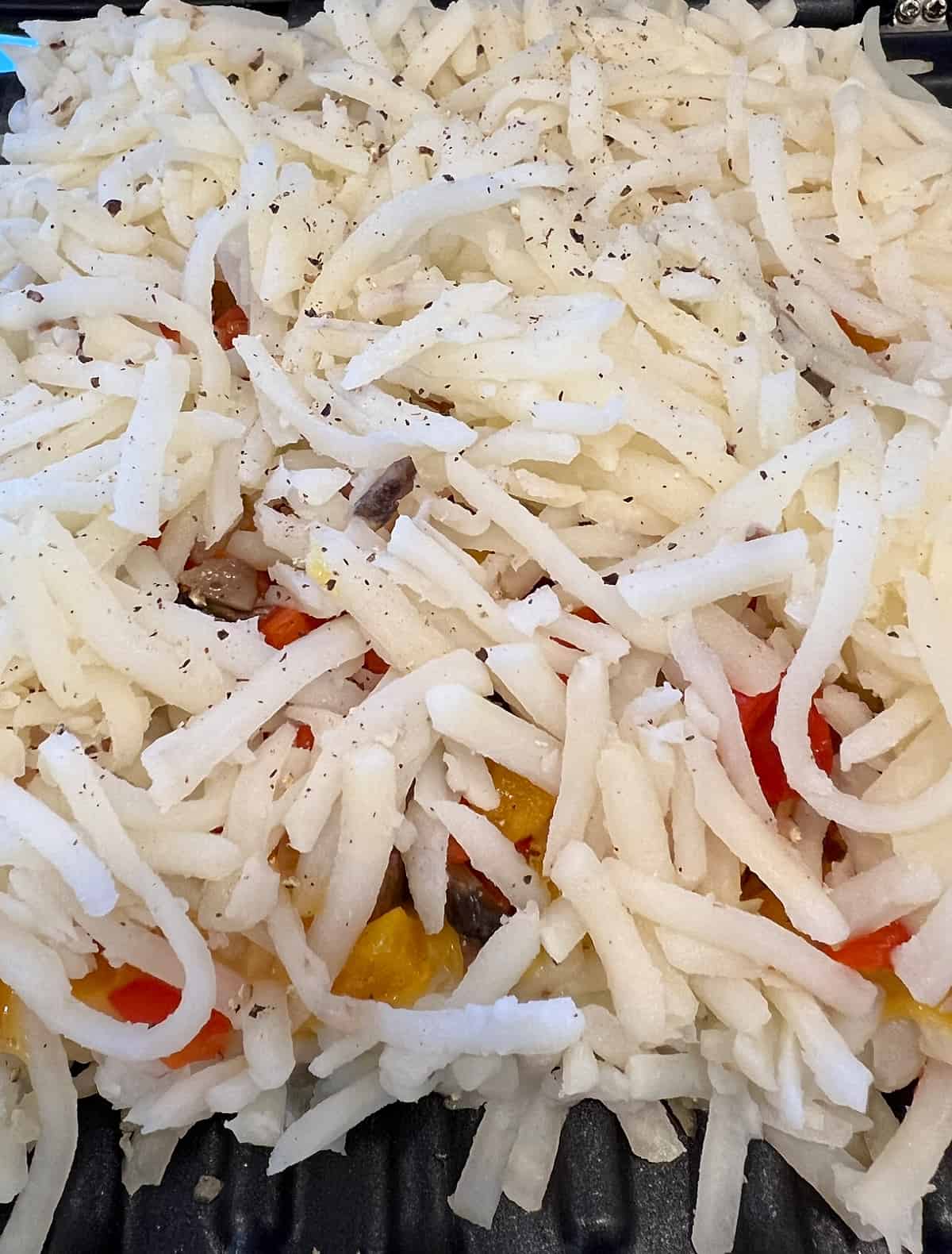 top layer of simply potatoes on a vegan omelette
