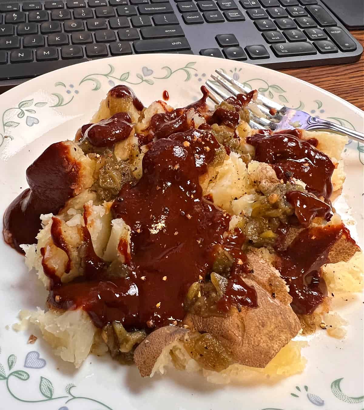 plate of cooked potatoes covered in New Mexican red Chile sauce