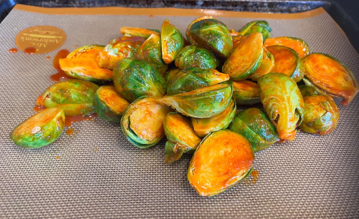 brussel sprouts on a baking sheet with Gochujang 