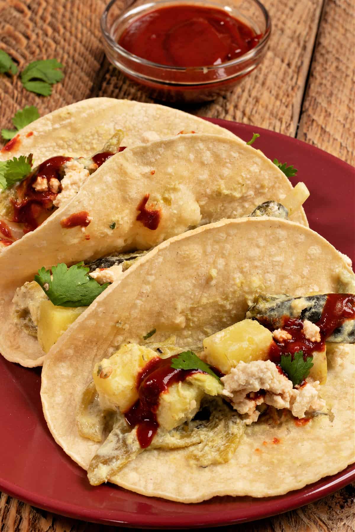 a plate of papas con rajas tacos