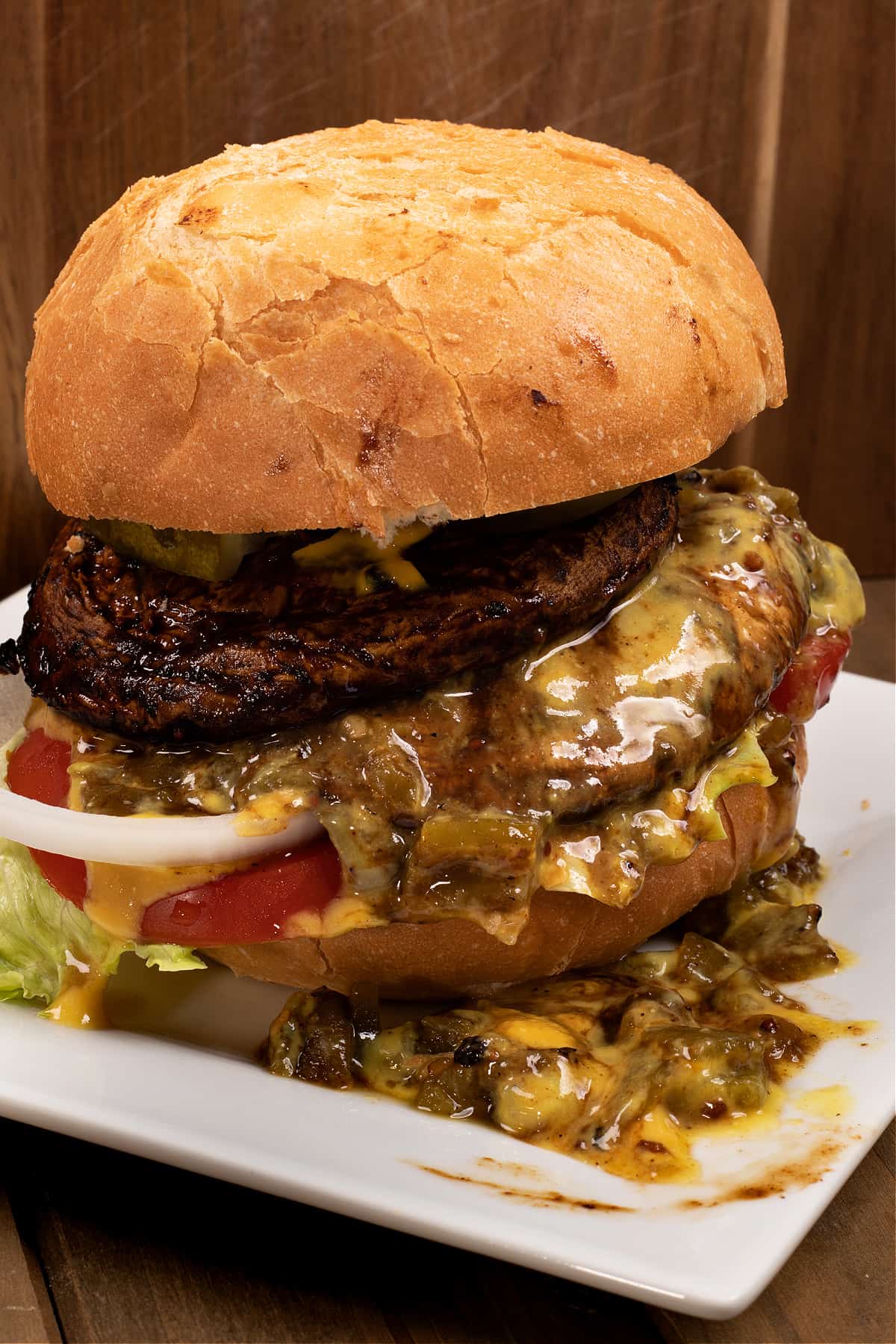 fully dressed green Chile portobello cheeseburger with Hatch Green Chile and vegan cheese sauce