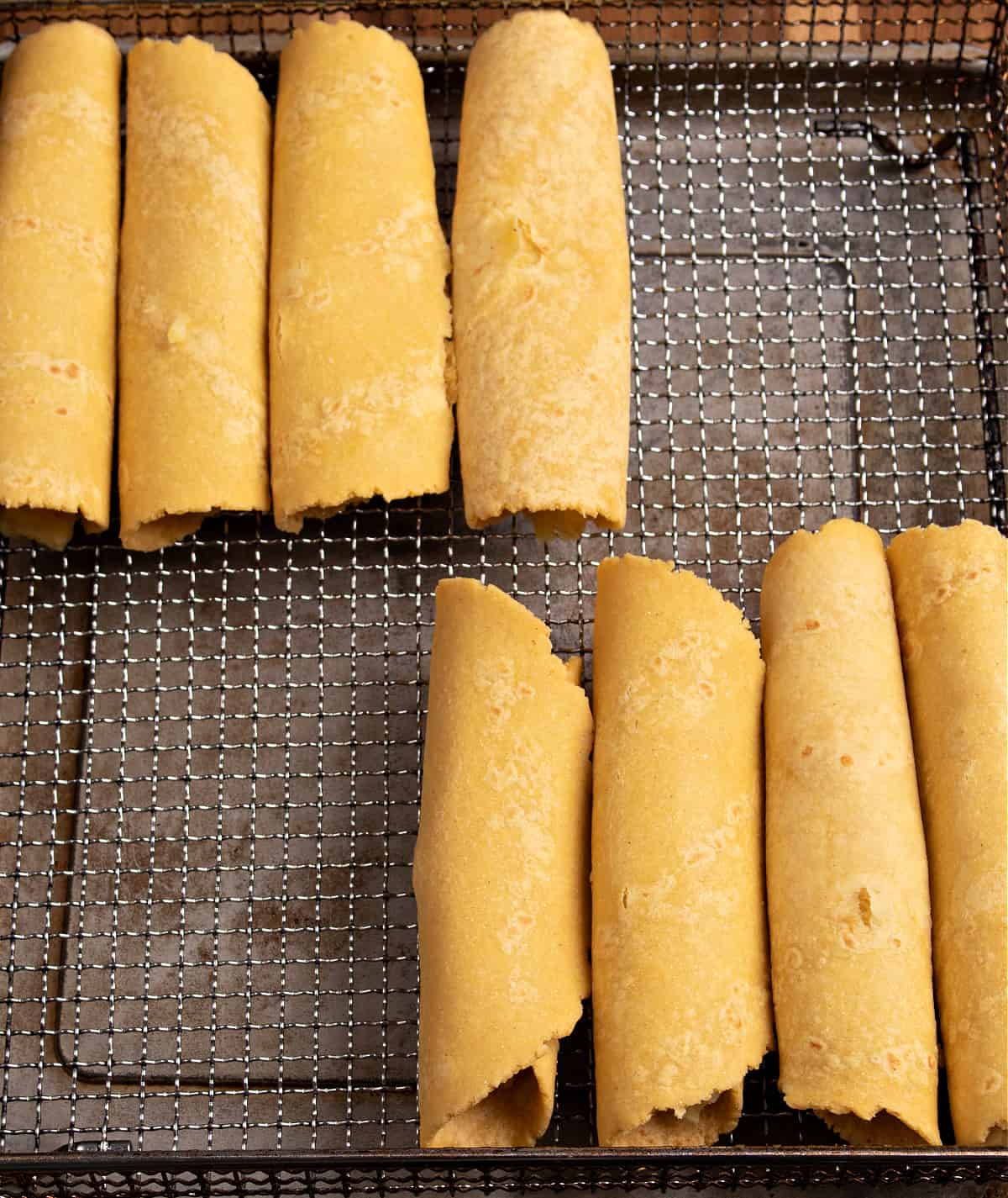 Photo of my air dryer tray filled with my mashed potato taquitos