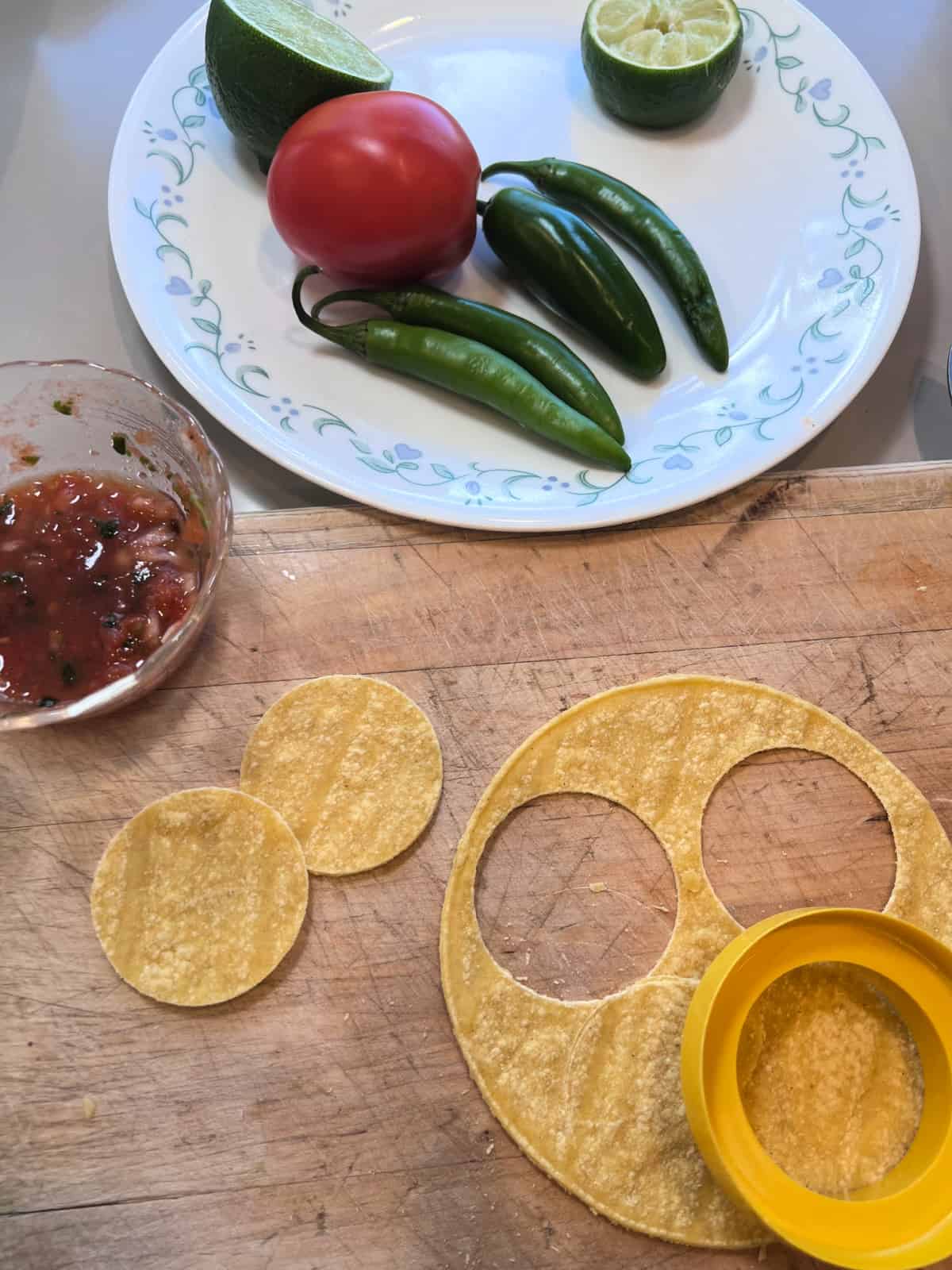 A cookie cutter makes perfectly round tortilla chips for dipping in my super easy salsa roja