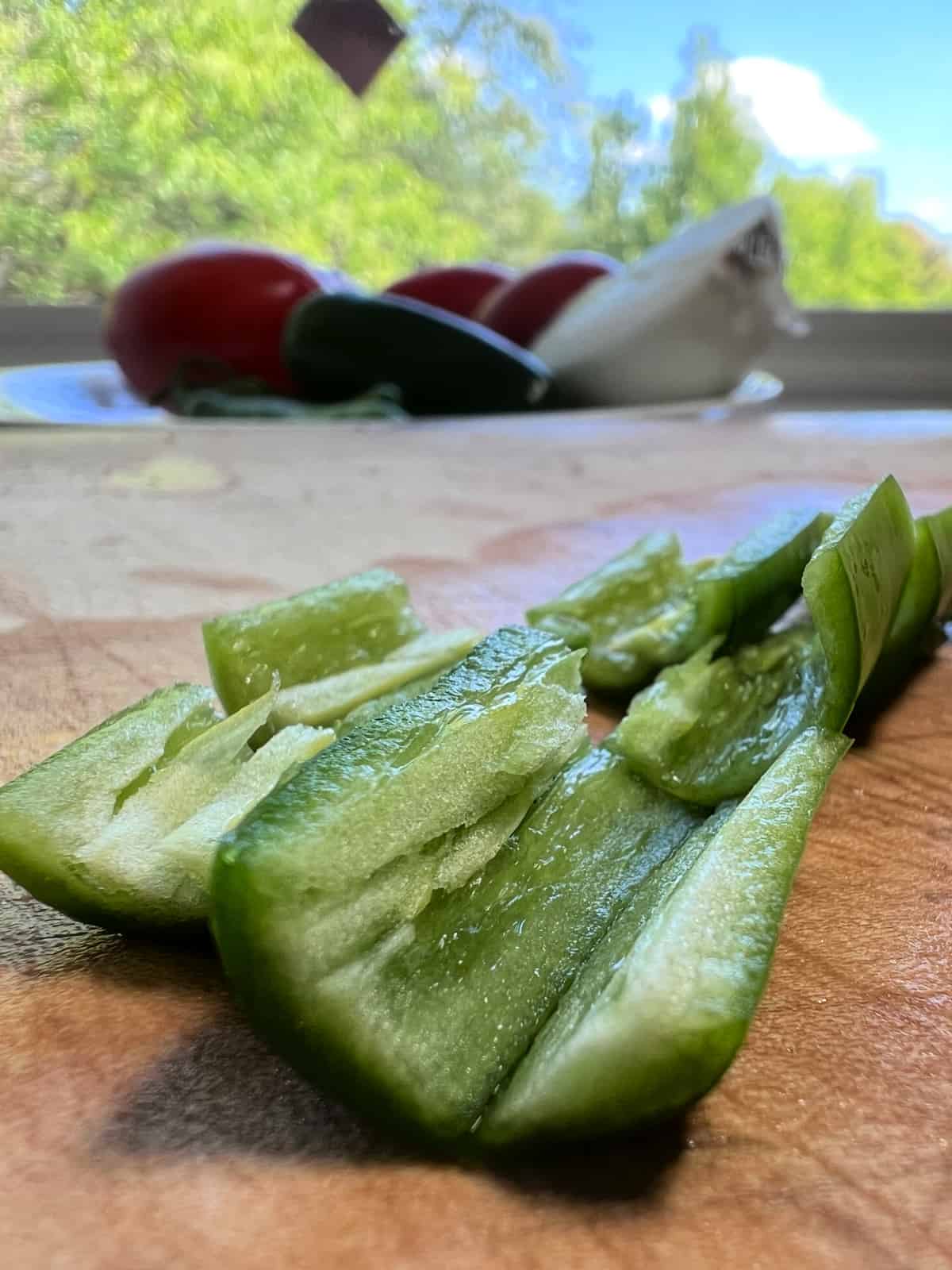 Removing the Serrano seeds for making mild salsa roja