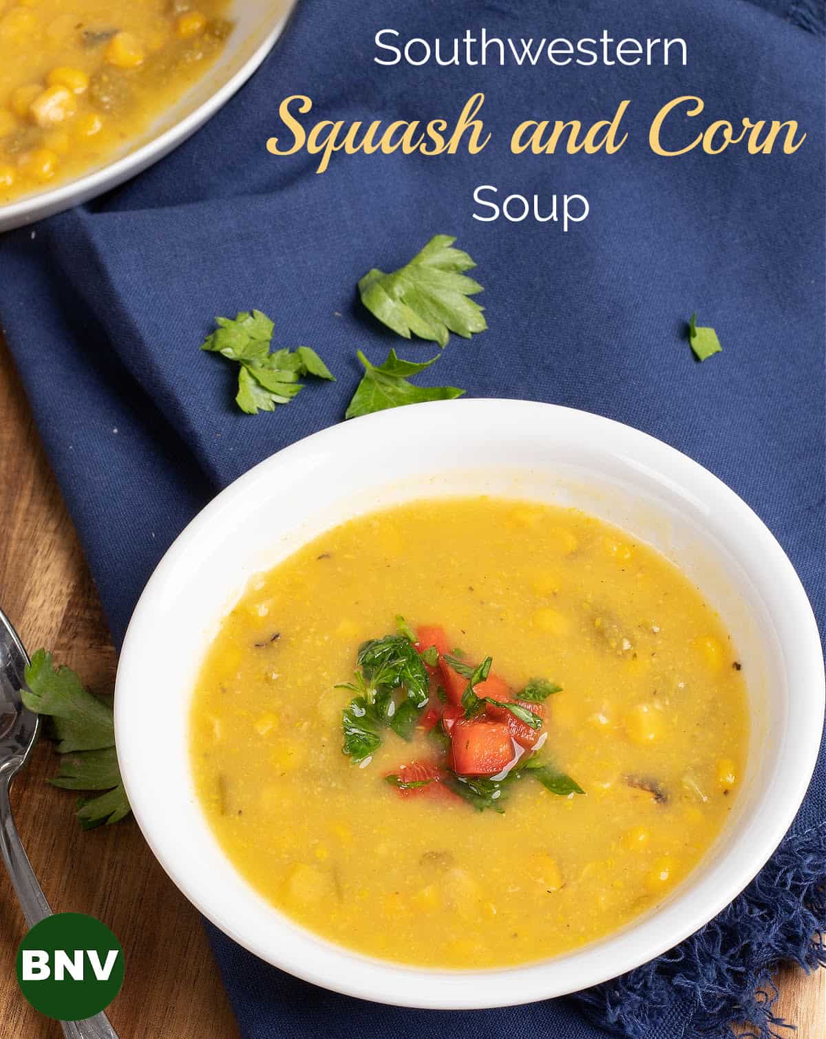 Bowl of southwestern squash and corn soup with a ramekin of red pepper relish
