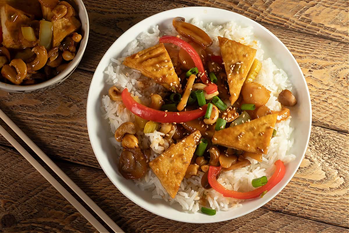 bowl of vegan cashew chicken on rice