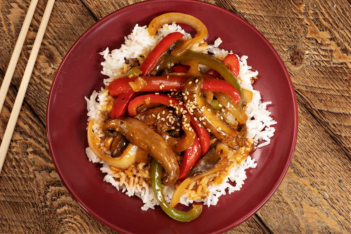 plate of vegan pepper steak with chopsticks