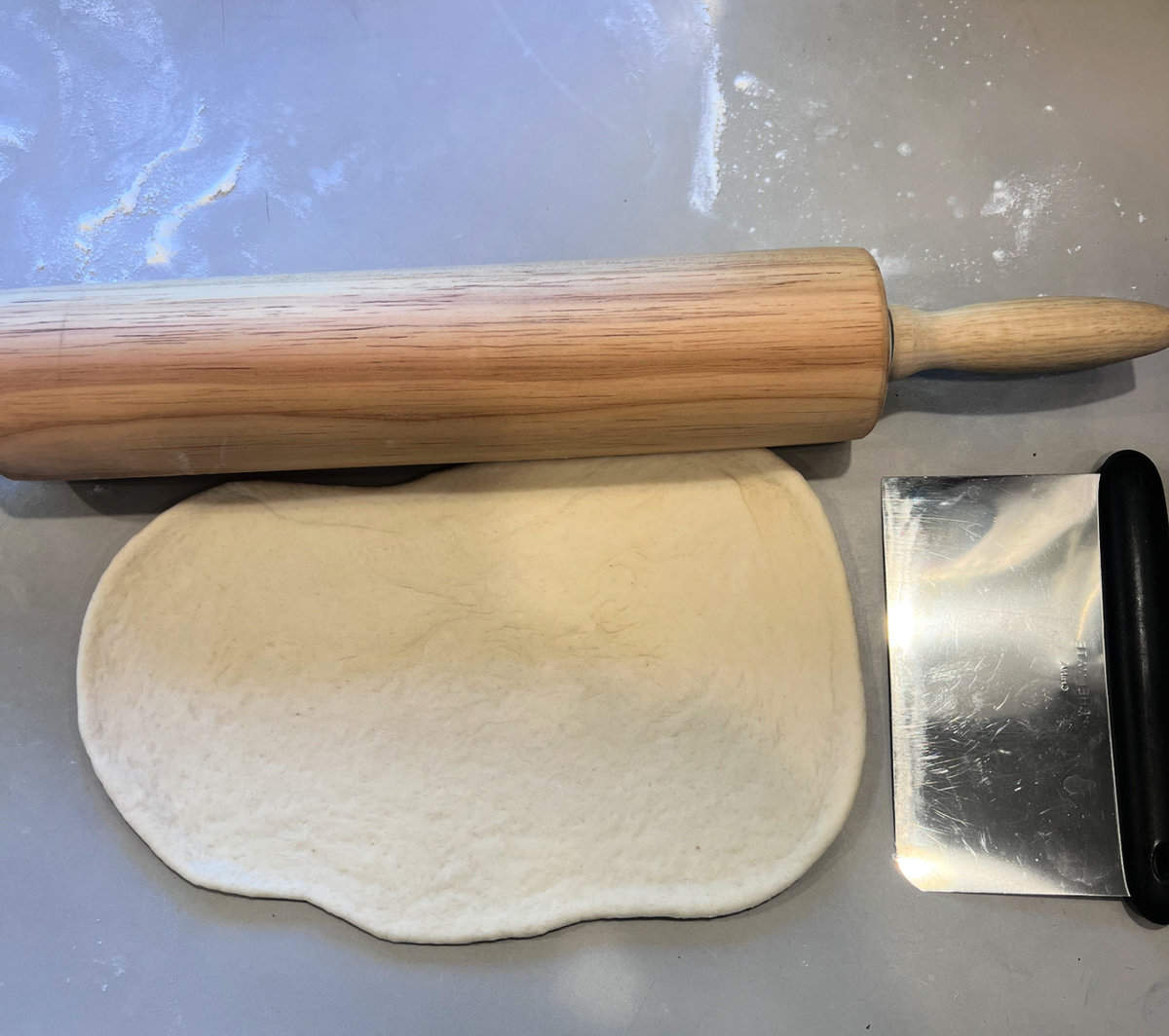 rolling out dough for vegan runzas